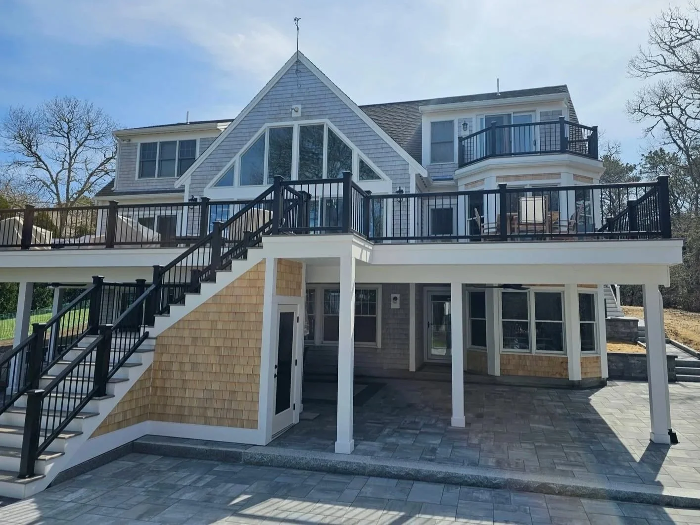 Composite deck with entertaining space in Mashpee, MA